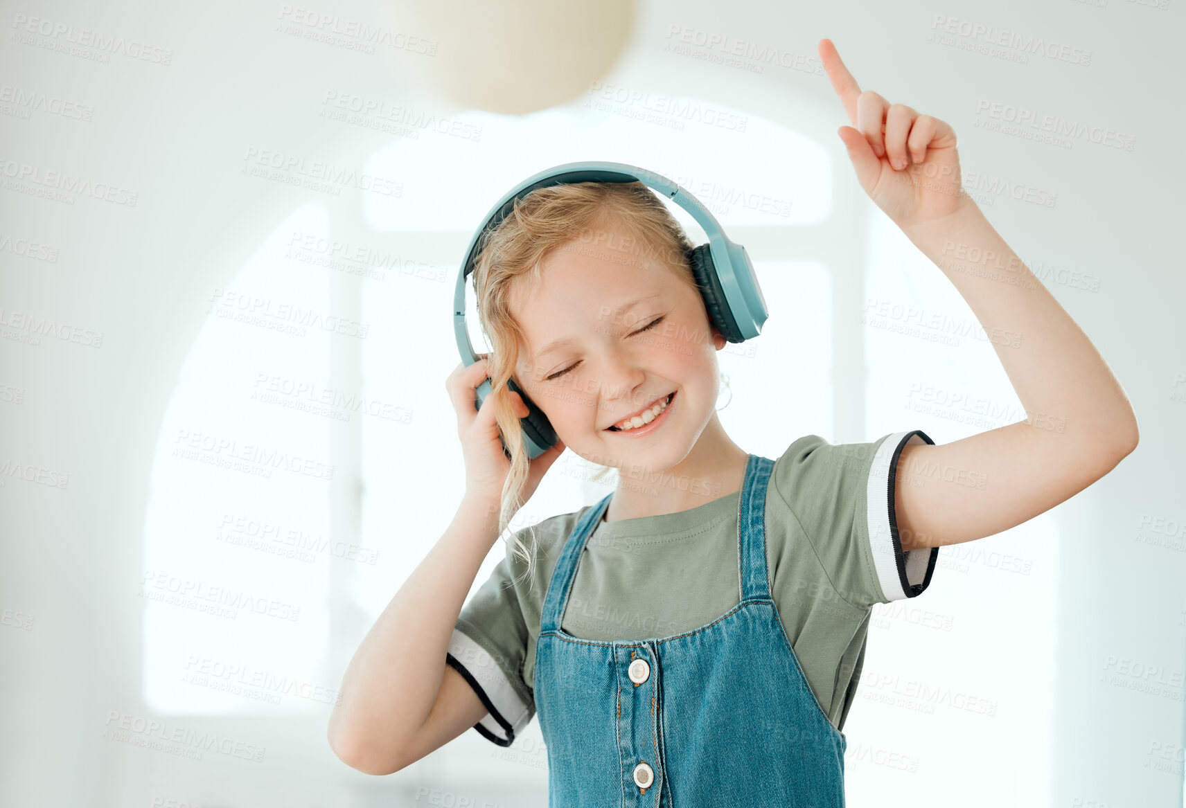 Buy stock photo Listening, music and child with headphones, smile and peace with streaming on app, online and audio. Home, podcast and girl with subscription for sound, dancing and enjoy with radio, relax and hear