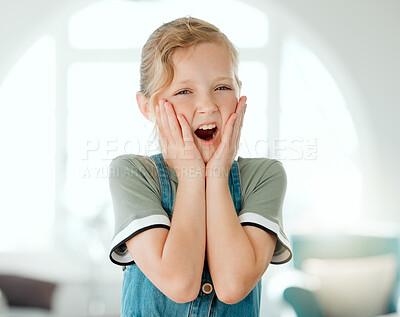 Buy stock photo Shot of an adorable little girl standing alone at home and looking surprised
