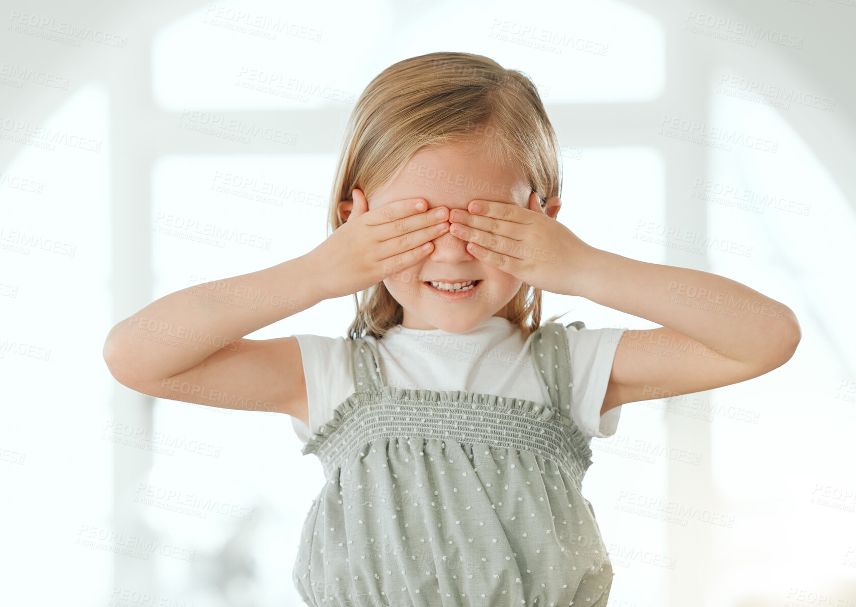 Buy stock photo Kid, hands and cover eyes in home with game, play and blind emoji gesture with smile. Silly, fun and hide face for peekaboo with shy, happy and surprise of young girl with announcement and joy