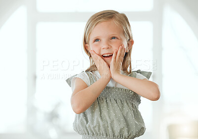 Buy stock photo Shot of an adorable little girl standing alone at home and looking surprised