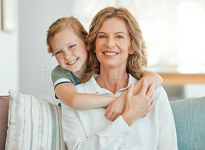 Buy stock photo Girl, grandmother and happy on sofa with portrait for bonding, care and embrace on weekend with childhood love. Grandma, kid and smile together in family house with hug, affection and relax on couch.