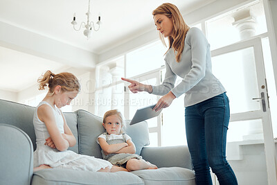 Buy stock photo Tablet, online safety and mother scolding girl child on sofa in living room of home for development. Discipline, social media and technology with parent teaching lesson to daughter in apartment