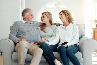 Buy stock photo Mature parents, daughter and happy on couch in home for care, bonding and support in England. People, family and smile or laugh on sofa in living room on break for unity, relax and trust with love