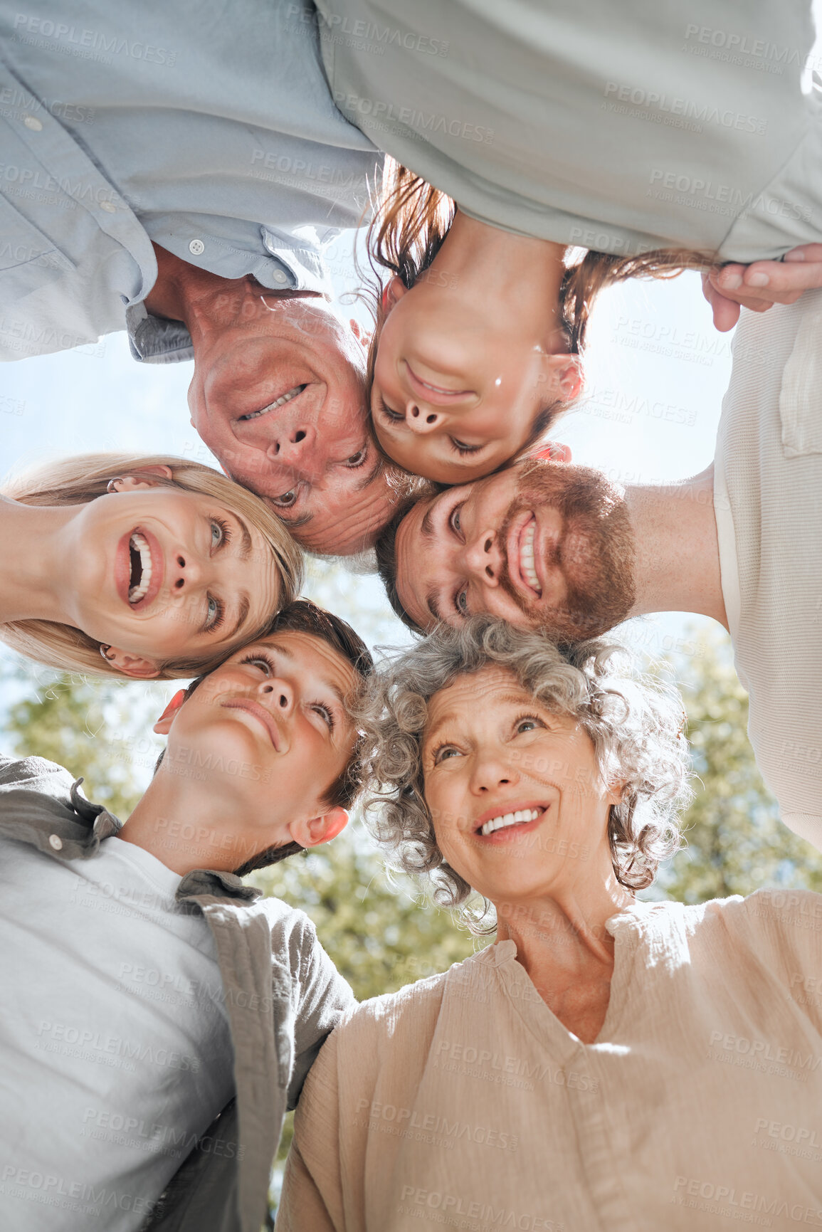 Buy stock photo Family, huddle and kids outdoor with grandparents, happy and holiday with parents in park with love. Trust, below and backyard with hug, care and support in circle with solidarity and fun together