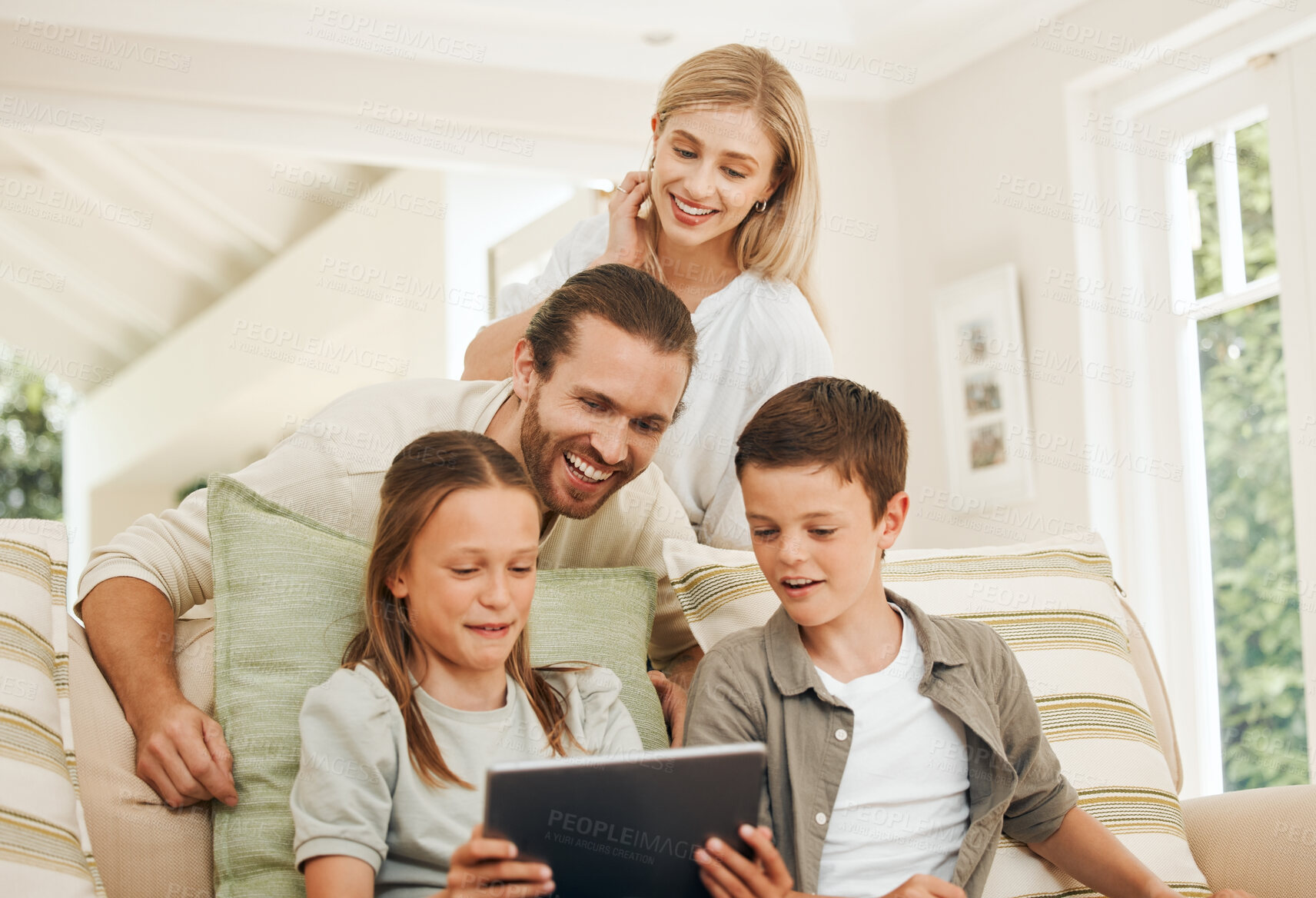 Buy stock photo Children, father and mother on sofa with tablet for gaming, streaming or video in home together. Education, smile and subscription with happy family in apartment for development, learning or study