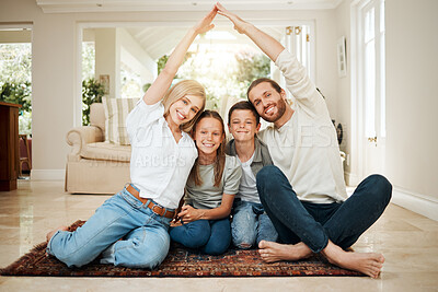 Buy stock photo Shot of a young couple ensuring that their family's home is covered