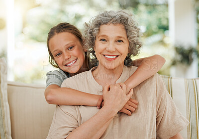 Buy stock photo Shot of a little girl hugging her grandmother