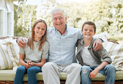 Buy stock photo Shot of a senior man sitting outside with his two grandchildren