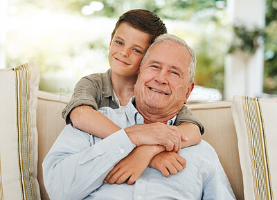 Buy stock photo Shot of a mature man being hugged by his grandson