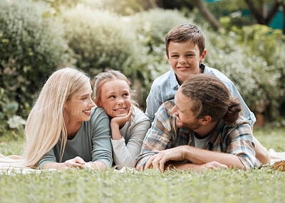 Buy stock photo Shot of a young family spending some time outside together