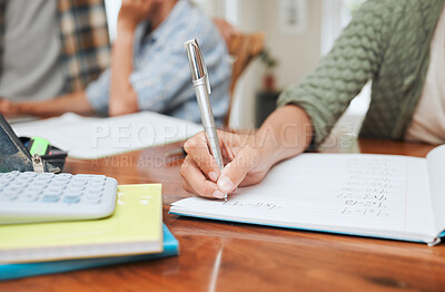 Buy stock photo Shot of a young girl doing her homework at the kitchen table at home