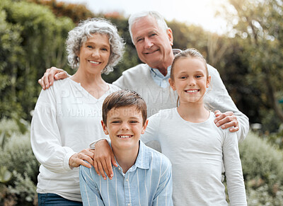 Buy stock photo Shot of two siblings posing for a picture with their grandparents outside