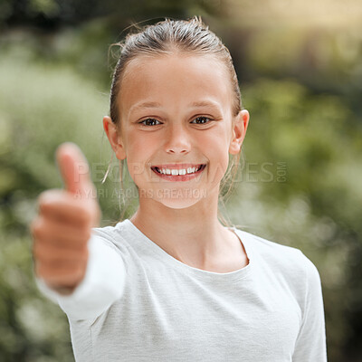 Buy stock photo Shot of an adorable little girl showing the thumbs up while standing outside
