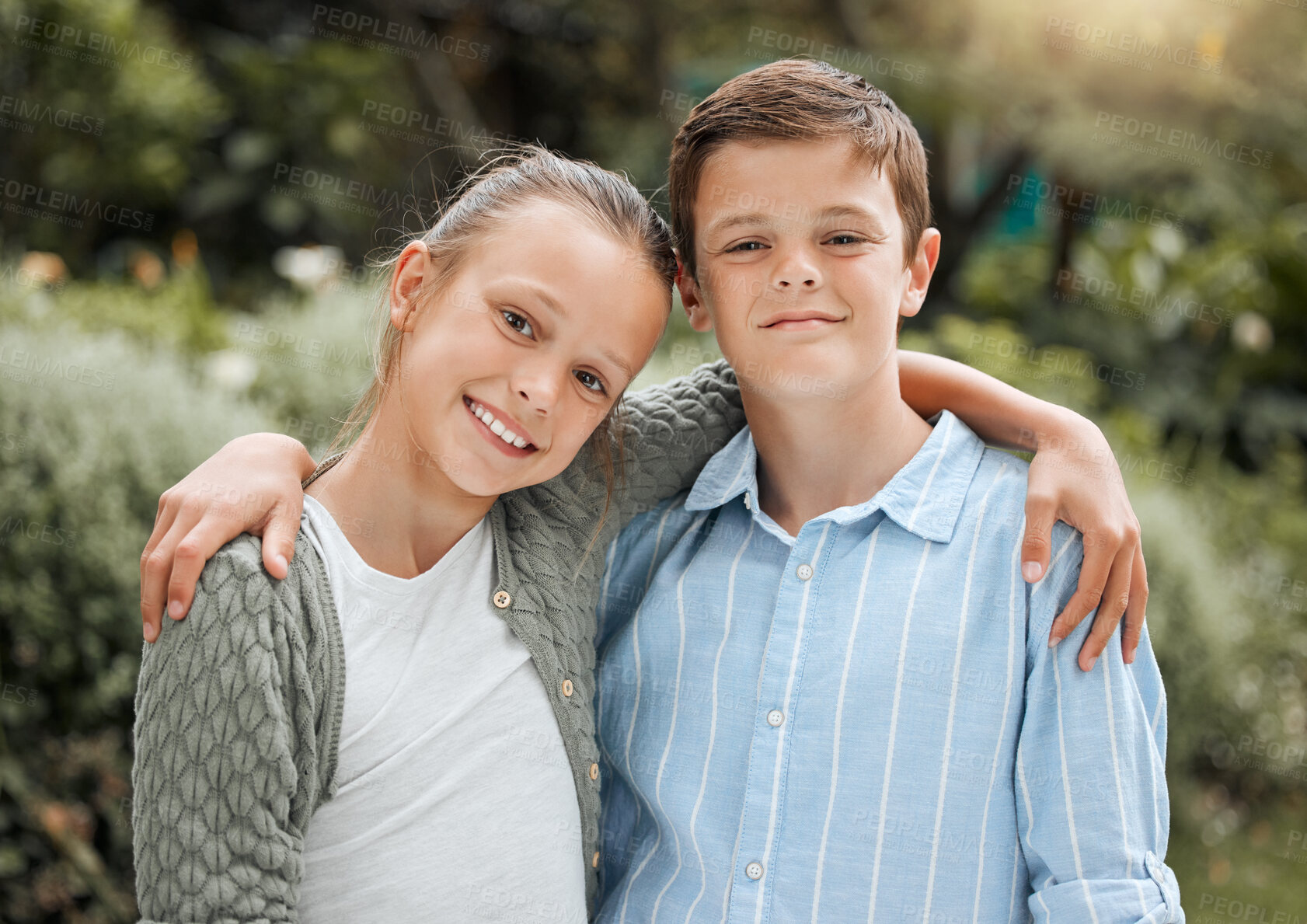 Buy stock photo Shot of two young siblings bonding while outside together