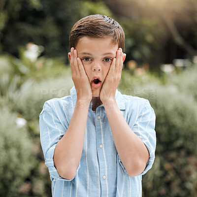 Buy stock photo Shot of an adorable little boy  looking surprised while standing outside