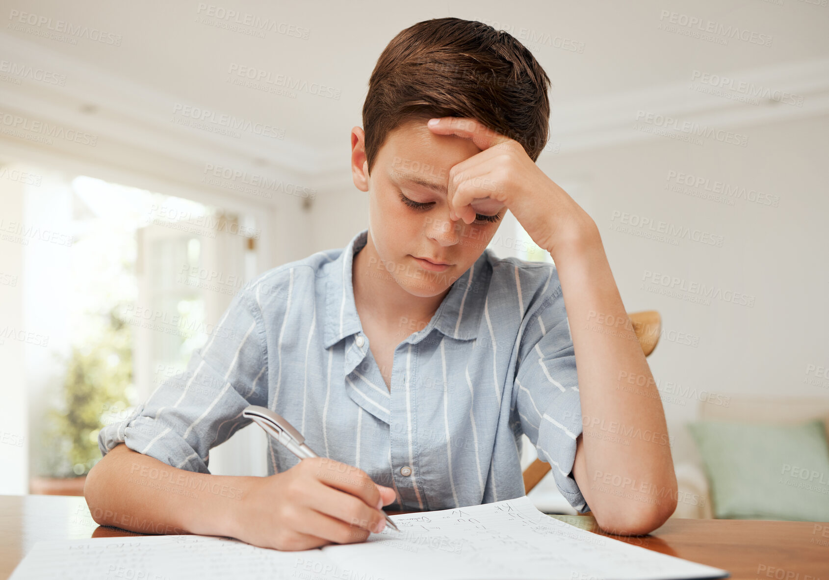 Buy stock photo Learning, home school and sad kid writing in notebook to study language, knowledge or test preparation. Homework, boy and serious child with pen for english project, education and letter with stress