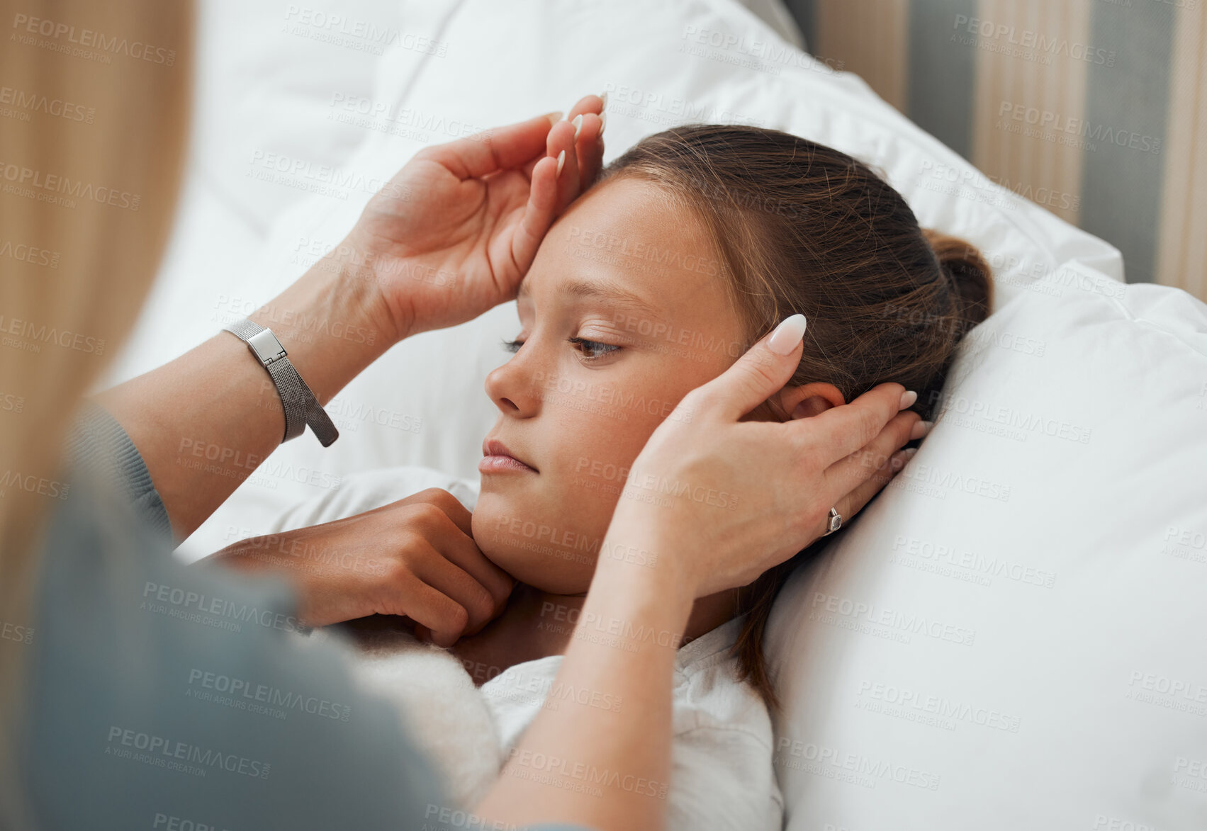 Buy stock photo Shot of an unrecognizable Mother checking a sick little girl's temperature at home