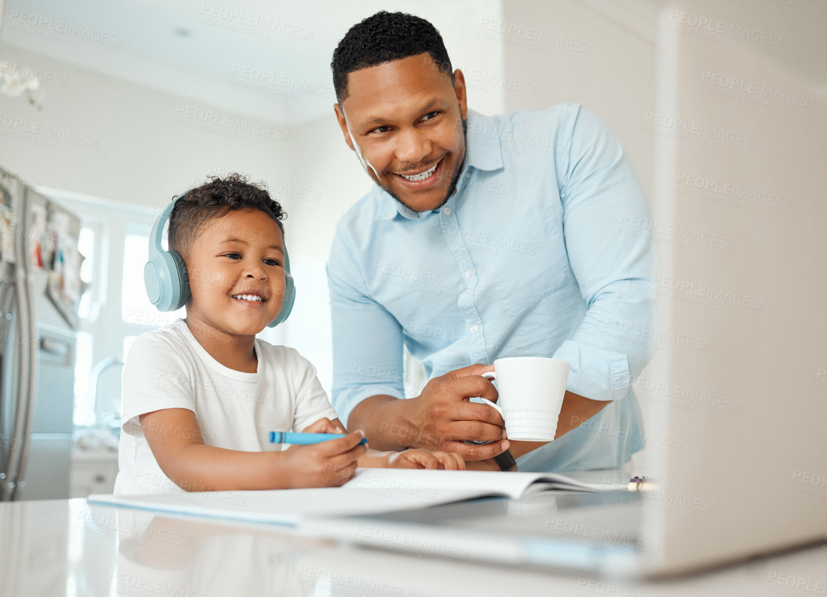 Buy stock photo Shot of a father and son doing homework together at home