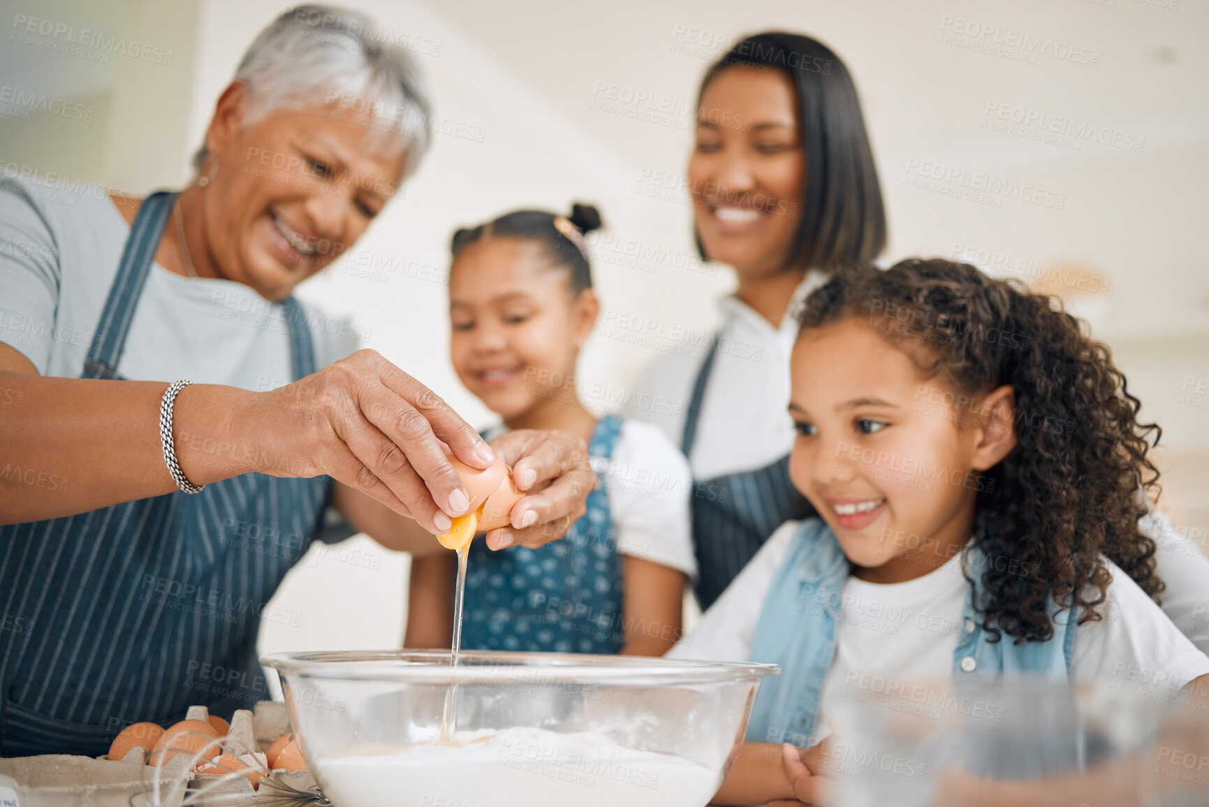 Buy stock photo Shot of a multi-generational family baking together at home