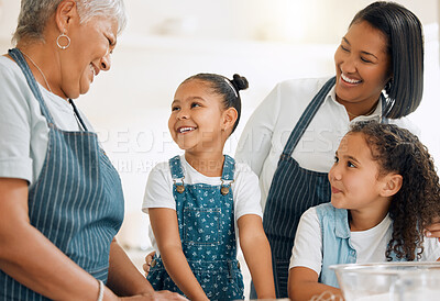 Buy stock photo Shot of a multi-generational family baking together at home