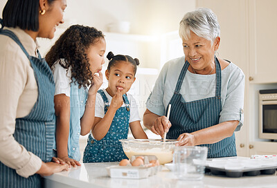Buy stock photo Shot of a multi-generational family baking together at home