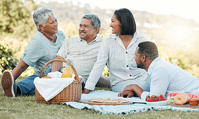 Buy stock photo Shot of a family enjoying a picnic