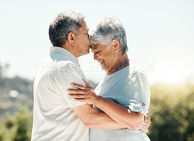 Buy stock photo Happy, outdoor and senior couple with kiss, hug and bonding together in park with love. Anniversary, smile and garden with lawn, care and support with romance and marriage in retirement and nature