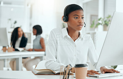 Buy stock photo Cropped shot of an attractive young female call center agent working at her desk in the office