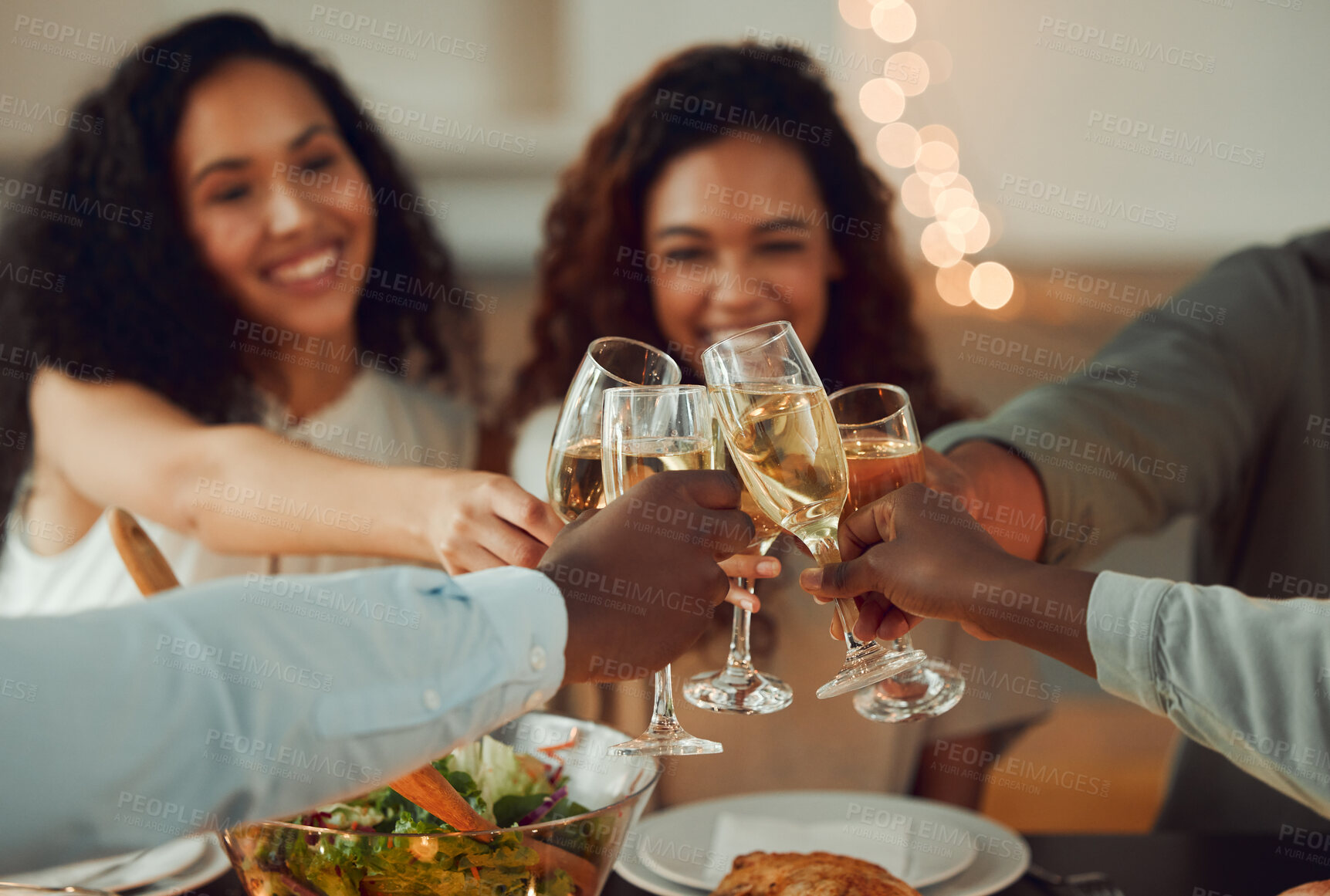 Buy stock photo Home, hands and friends with alcohol for cheers, celebration and bonding together in social gathering. Group, people and glasses with sparkling wine for achievement, reunion and toast in fine dining