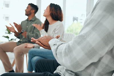 Buy stock photo Shot of an unrecognisable group of people sitting together and clapping during group therapy