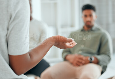 Buy stock photo Cropped shot of an unrecognisable woman sitting and talking to her support group