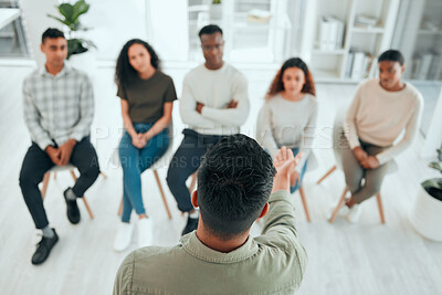 Buy stock photo Shot of an unrecognisable man standing and talking to his support group