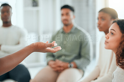 Buy stock photo Shot of an unrecognisable woman sitting and talking to her support group