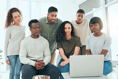 Buy stock photo Shot of a diverse group of people using a laptop during group therapy