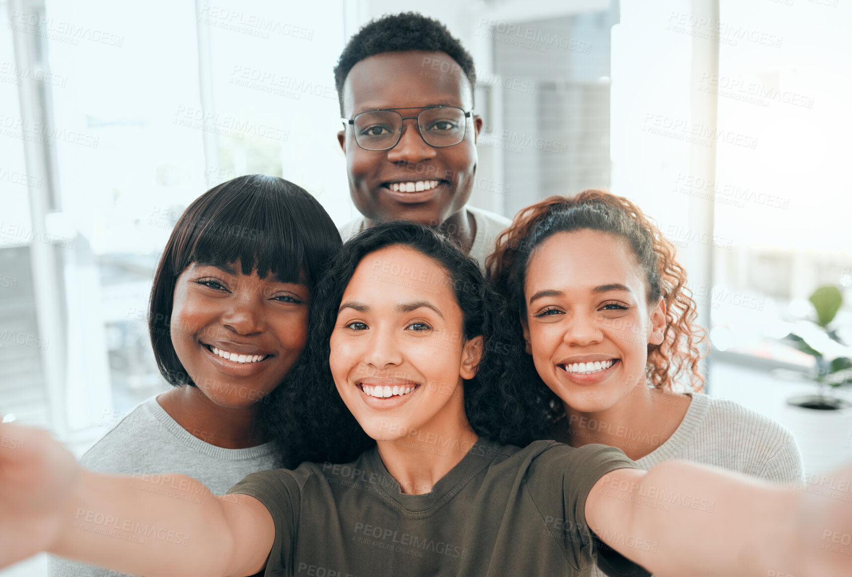 Buy stock photo Shot of a diverse group of people standing together and taking a selfie after group therapy