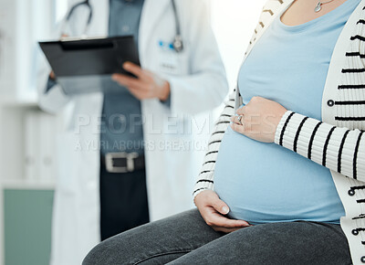 Buy stock photo Shot of a unrecognizable doctor during a consultation with a pregnant patient in a clinic
