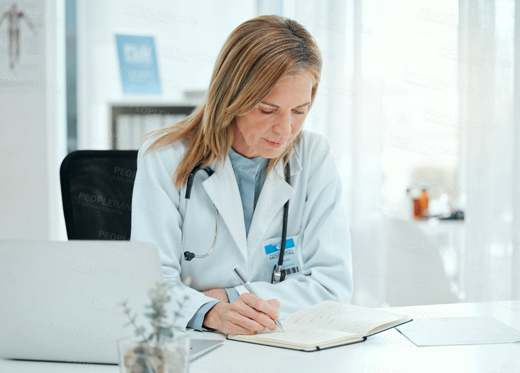 Buy stock photo Doctor, book and writing in office for healthcare, notes and tracking patient treatment plan. Schedule, mature cardiologist and journal in practice for planning, research and medical observation