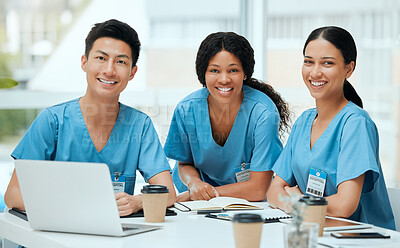 Buy stock photo Shot of a group of young doctors in a meeting at a hospital