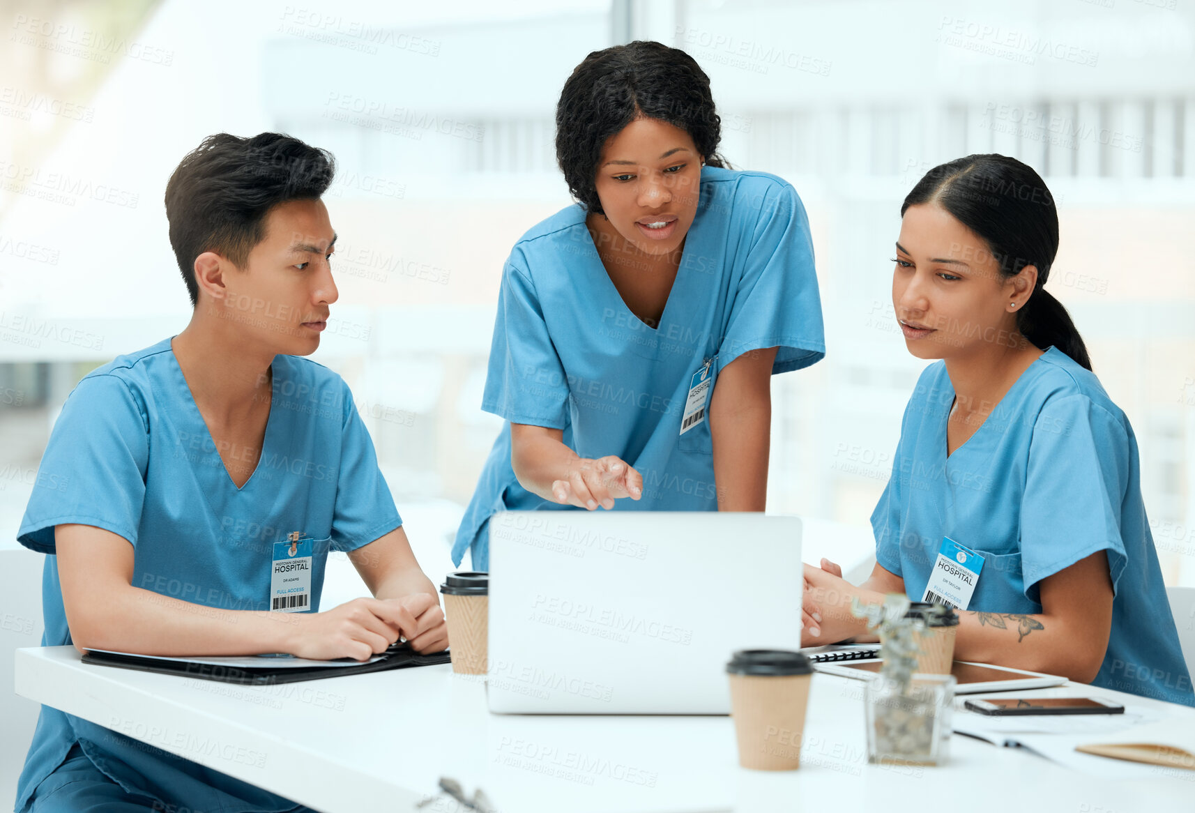 Buy stock photo Meeting, people and diversity with laptop as medical students in teamwork, internship or clinic. Group, discussion and confidence in hospital on tech for health, review and feedback in brainstorming