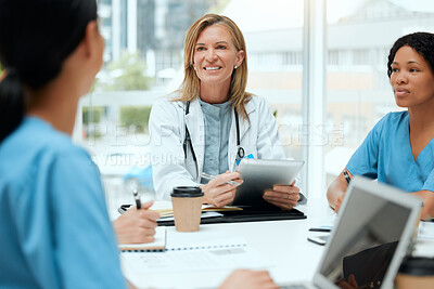 Buy stock photo Doctor, meeting and medical students on technology with group for healthcare, review or feedback. People, talking and diversity in discussion for teamwork, staff and internship in clinic or hospital