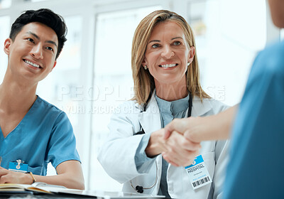 Buy stock photo People, doctor and nurse with hand shake at boardroom for welcome and congratulations on internship. Employees, office and happy or smile with greeting for job interview, opportunity and recruitment