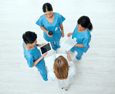 Buy stock photo Teamwork, tablet or above of doctors in meeting planning a surgery strategy in collaboration together. Top view of healthcare nurses talking or speaking of online news reports, feedback or research 