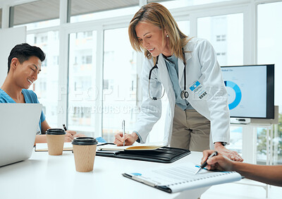 Buy stock photo Computer screen, training or writing and doctor in hospital boardroom with nurse students. Coaching, notebook and seminar with people in clinic for healthcare, consulting or medical internship