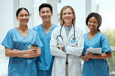 Buy stock photo Portrait, medical and a woman doctor arms crossed, standing with her team in the hospital for healthcare. Leadership, health and teamwork with a female medicine professional in a clinic for treatment
