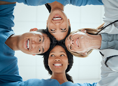 Buy stock photo Happy, teamwork or faces of doctors in huddle with a smile collaboration for healthcare mission goals. Smiling, team building or low angle of nurses with group support, motivation or private secrets