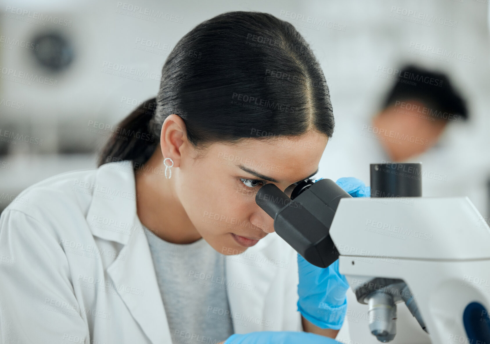 Buy stock photo Woman, microscope and science in lab for healthcare, investigation or experiment results. Scientist, tech or study at table for medicine engineering, pharmaceutical development or research innovation