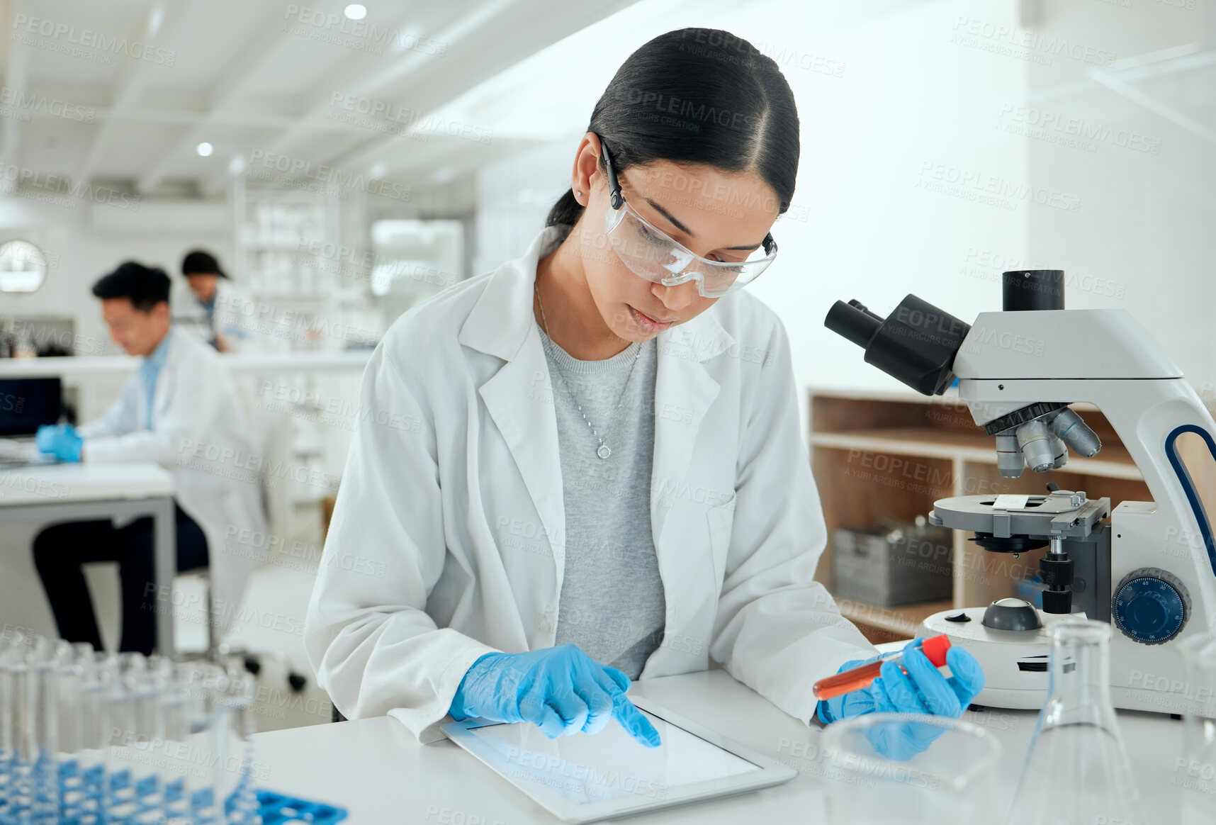 Buy stock photo Scientist, woman and test tube with tablet in lab for dna analysis, medical research or pharmaceutical trial. Pharma company, professional or blood vial for vaccine development or experiment with ppe