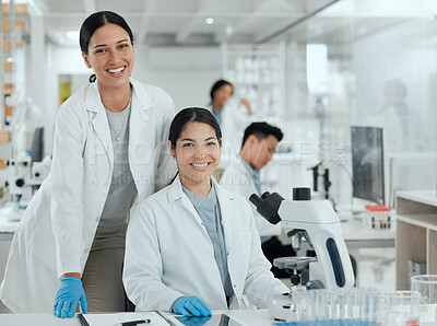 Buy stock photo Shot of two beautiful women working together in a lab