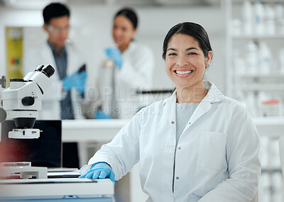 Buy stock photo Shot of a confident young female scientist in her lab