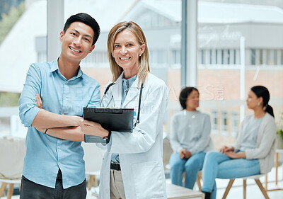 Buy stock photo Shot of a mature doctor and her patient discussing his latest results in the waiting room
